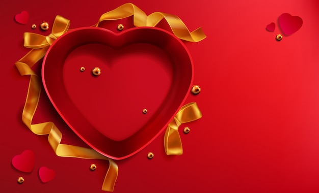 Czerwone pudełko w kształcie serca, złota wstążka perłowa