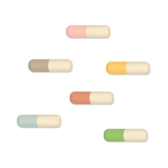 Dwie kolorowe kapsułki medyczne na białym tle kolorowe pigułki