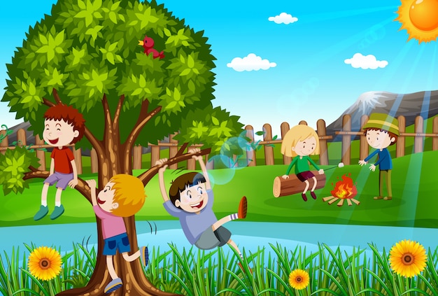Dzieci bawiące się i biwakujące w parku