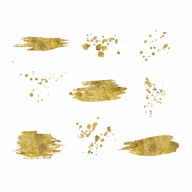 Kolekcja złotych pociągnięć pędzlem splatters na białym tle