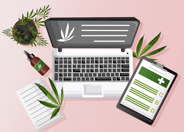 Kompozycja marihuany z organicznym olejem cbd, schowkiem papierowym i miejscem na marihuanę na laptopie