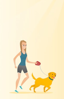 Młoda kobieta spaceru z psem.