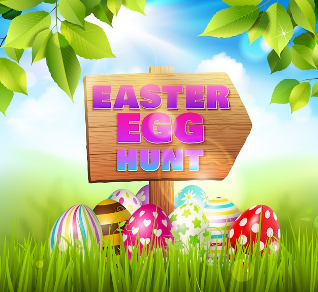Wielkanocny tło skład z Easter jajkami kłaść na zielonej trawie i drewnianym drogowym znaku z tekst ilustracją