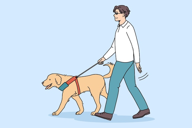 Wyszkolony pies przewodnik pomaga niewidomemu
