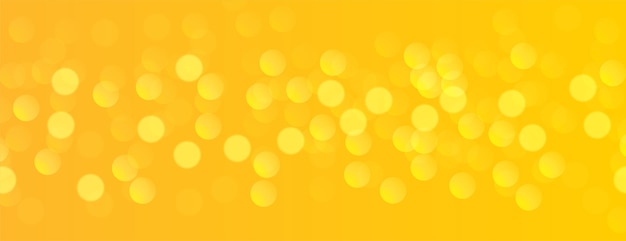 Bezpłatny wektor Żółty sztandar z efektem świetlnym bokeh