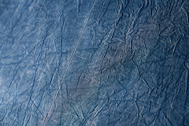 Abstrakcyjny projekt dżinsowego niebieskiego tła z zmarszczoną tkaniną w stylu vintage grunge