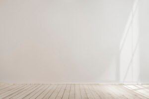 Bezpłatne zdjęcie biała pusta makieta betonowej ściany z drewnianą podłogą