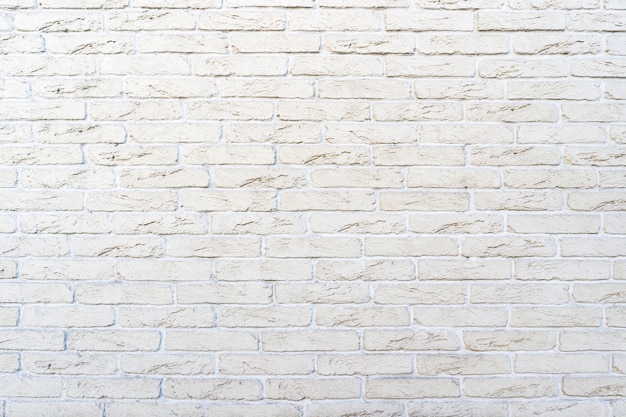 Biały mur z cegły. Tekstura cegły z białym wypełnieniem
