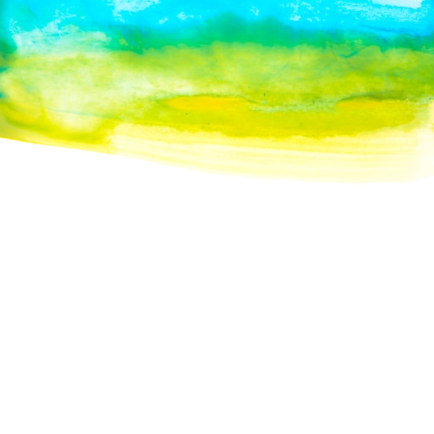 Bezpłatne zdjęcie błękitna i żółta akwarela rysuje na papierze