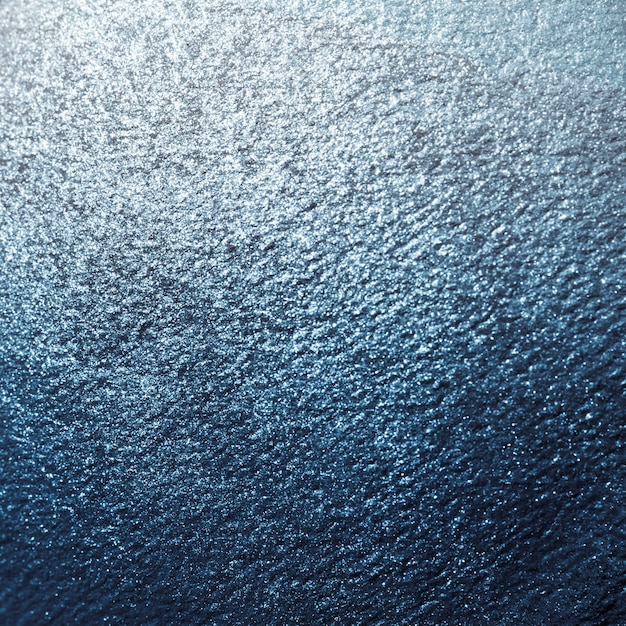 Błękitny błyszczący textured papierowy tło