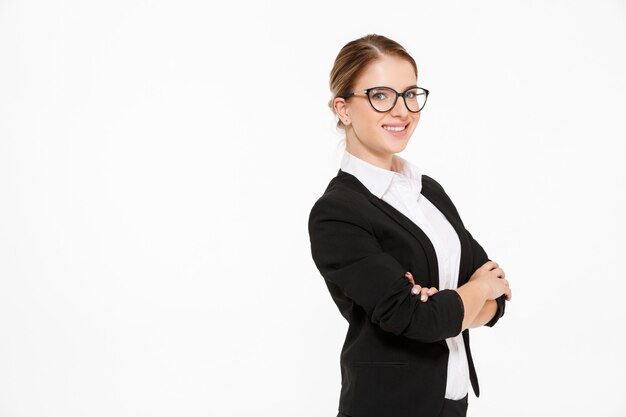 Boczny widok uśmiechniętej blondynki biznesowa kobieta w eyeglasses