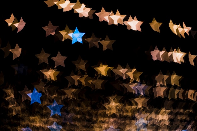 Bezpłatne zdjęcie bokeh tło z światłami w gwiazdowym kształcie