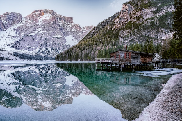 Brown Lakeside Cottage Beside Rocky Mountain