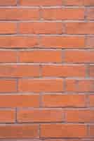Bezpłatne zdjęcie ceglany mur pomarańczowy tło