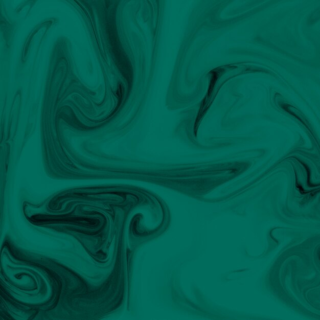 Close-up z zielonym i czarnym tle przepływu farby