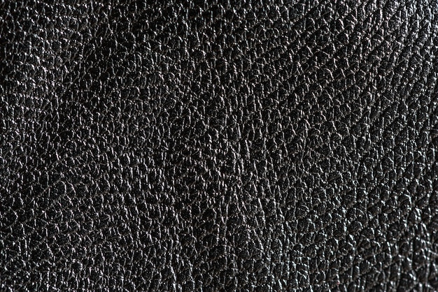 Czarne szorstkie skórzane teksturowane tło