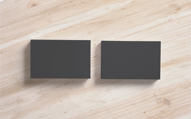 Bezpłatne zdjęcie czarne wizytówki sterty na drewnianym tle. szablon do prezentacji prezentacji.