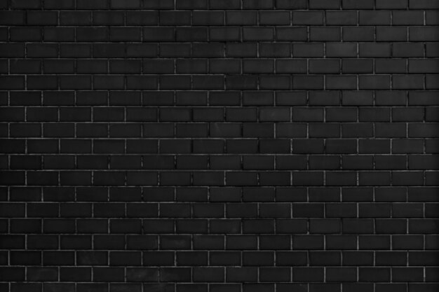 Czarny ceglany mur teksturowanej tło