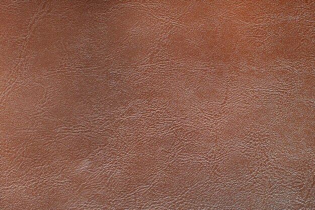 Czerwonawo-brązowe skórzane teksturowane tło