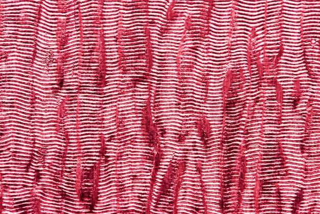 Czerwone błyszczące tkaniny teksturowane w tle