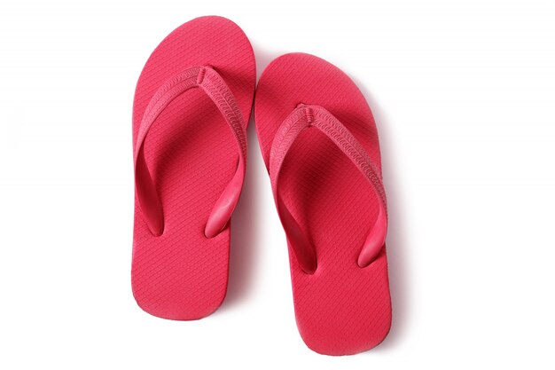 Czerwoni flipflops plaży sandały odizolowywający na białym tle