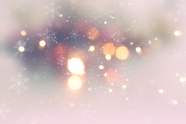 Dekoracyjne tło Boże Narodzenie ze śniegiem i bokeh światła
