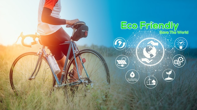 Ekologiczna koncepcja, zielona energia, redukcja dwutlenku węgla i redukcja zanieczyszczeń. koncepcja dnia bez samochodu, aby uratować świat i uratować ziemię. mężczyzna jeździ na rowerze pośród natury.