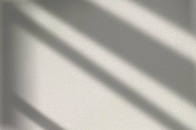 Bezpłatne zdjęcie estetyczne tło z cieniem okna podczas złotej godziny