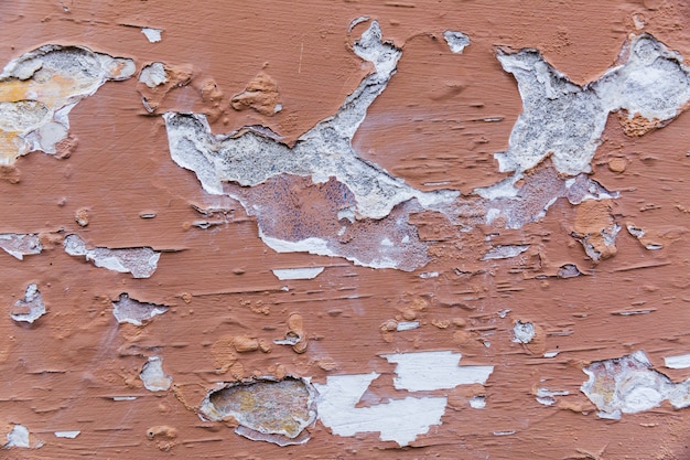 Bezpłatne zdjęcie farba zdziera szorstką betonową ścianę