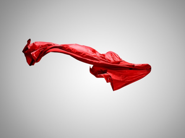 Gładka elegancka przezroczysta czerwona tkanina oddzielona na szarym tle.