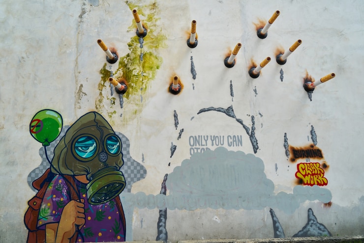 Bezpłatny plik Zdjęcie graffiti z papierosami przybity do ściany
