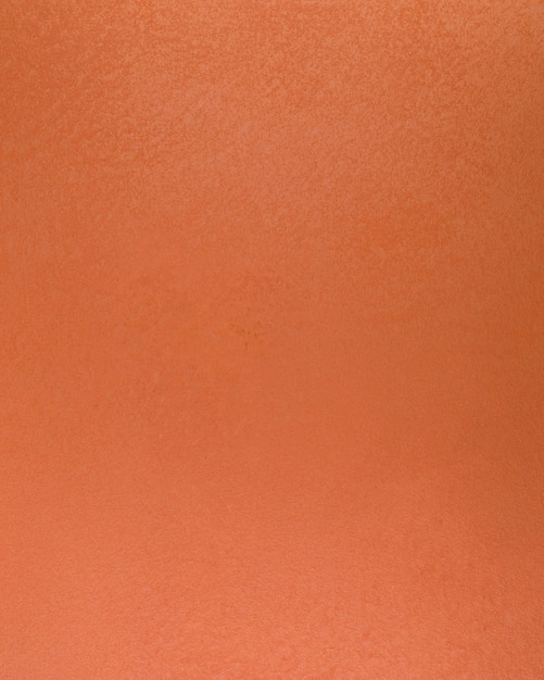 Gruba pomarańczowa powierzchnia ściany betonowej