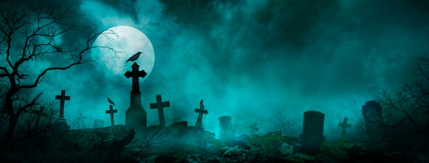 Halloweenowa tapeta z cmentarzem w nocy