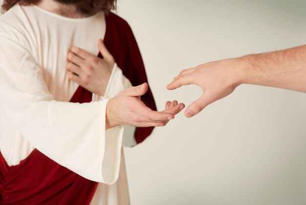 Jezus zbawienną rękę sięgającą do wiernych