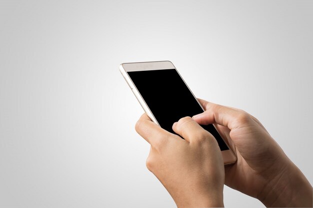 Kobieta Dłoń trzymająca inteligentny telefon pusty ekran. Skopiuj miejsce. Dłoń trzymająca smartphone na białym tle.
