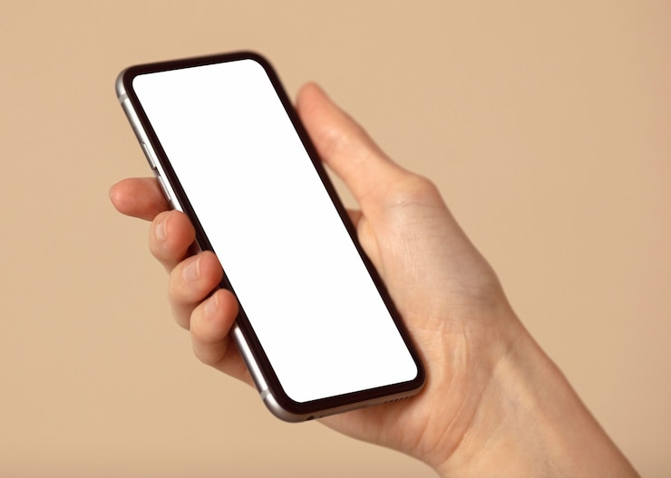 Bezpłatny plik Zdjęcie miejsce kopiowania telefonu komórkowego w ręku