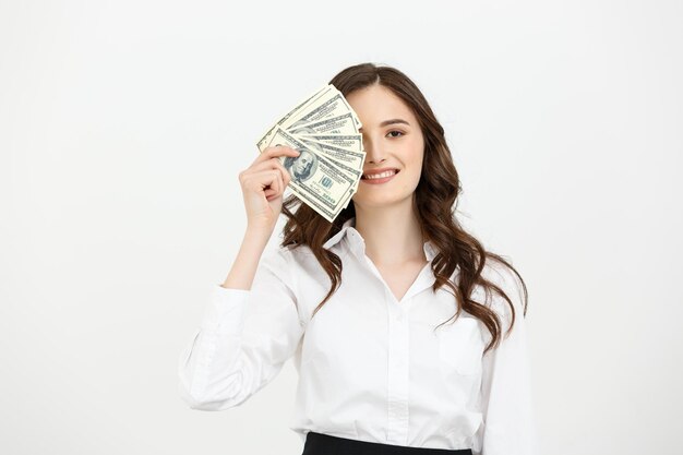 Młoda szczęśliwa biznesowa kobieta z dolarami w ręku Pojedynczo na białym tle