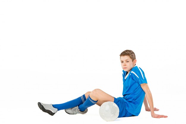 Młody chłopak z piłki nożnej