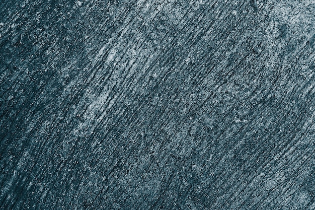 Niebieskie tło z teksturą betonu