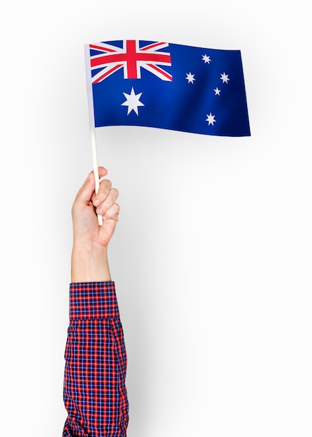 Bezpłatne zdjęcie osoba machająca flagą wspólnoty australijskiej