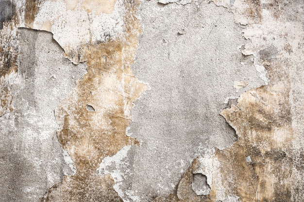 Pęknięty betonowy mur teksturowany w tle