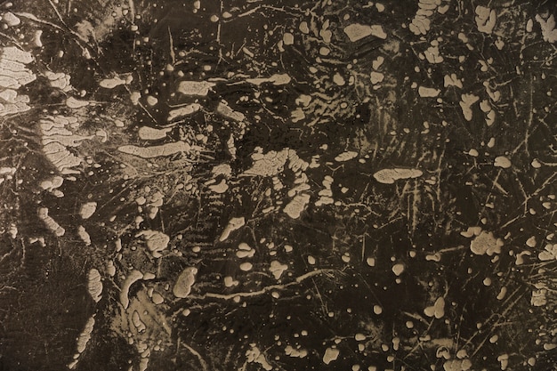 Bezpłatne zdjęcie plamy na ciemnej betonowej ścianie