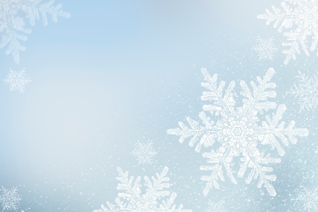 Bezpłatne zdjęcie płatki śniegu na niebieskim zimowym tle