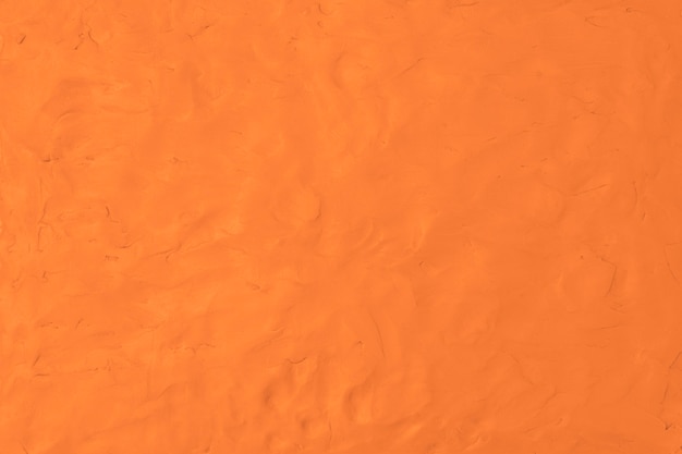 Pomarańczowa glina teksturowana tło kolorowe ręcznie robione sztuki abstrakcyjnej stylu