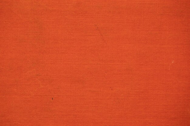 Pomarańczowa tkanina, stara okładka książki, tekstura lub tło.
