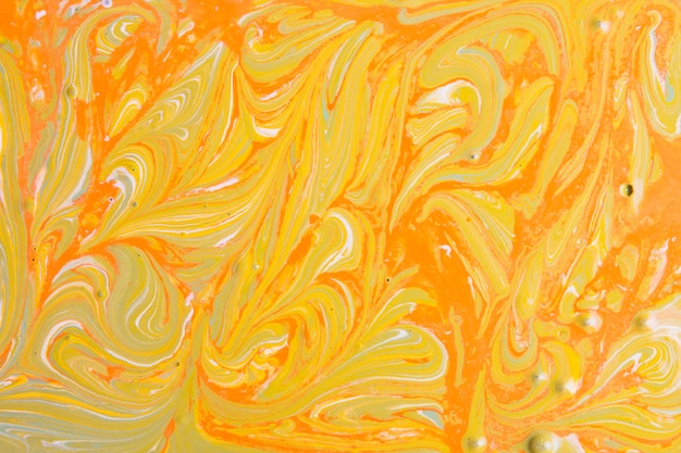 Pomarańczowy i żółty abstrakcjonistyczny tło