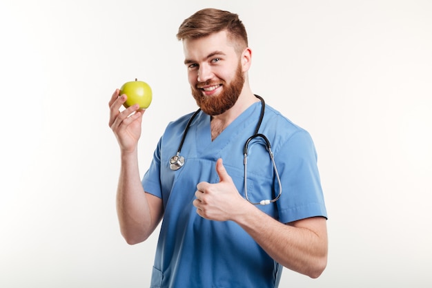 Portret przystojna lekarka patrzeje kamerę w błękitnym żakiecie