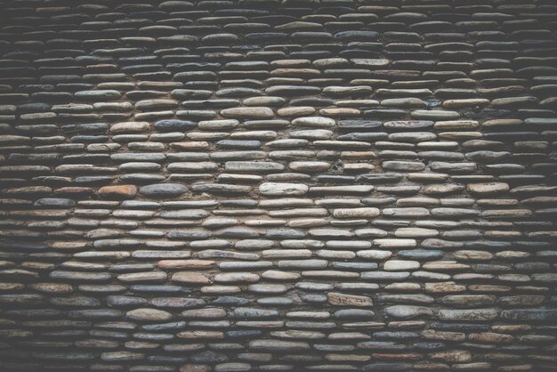 Prawdziwa powierzchnia ściany kamienia, ciemny filtr retro