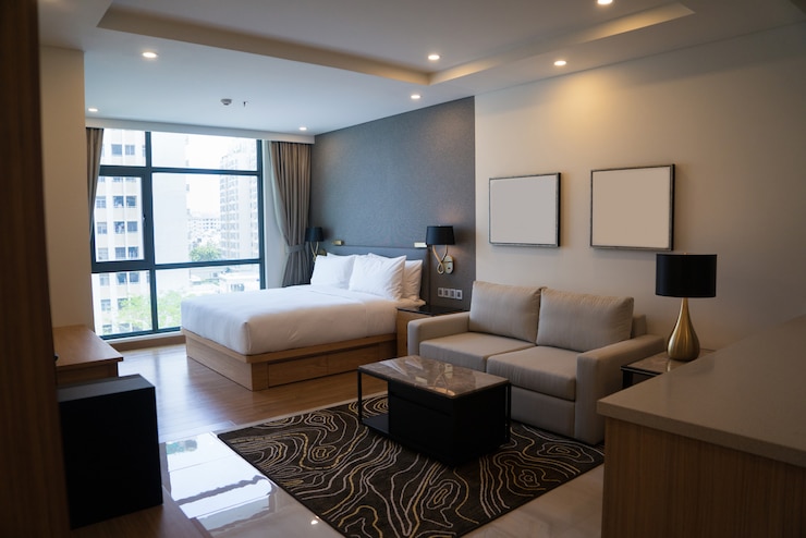 Bezpłatny plik Zdjęcie przytulny apartament typu studio z sypialnią i salonem.