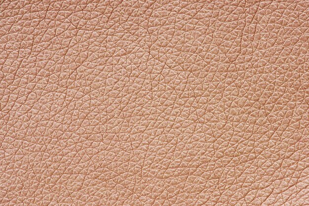 Różowo-złota skóra teksturowana w tle